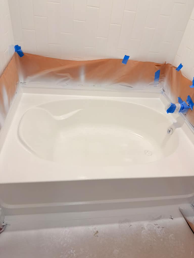 White bathtub protected during final post-remodel cleaning