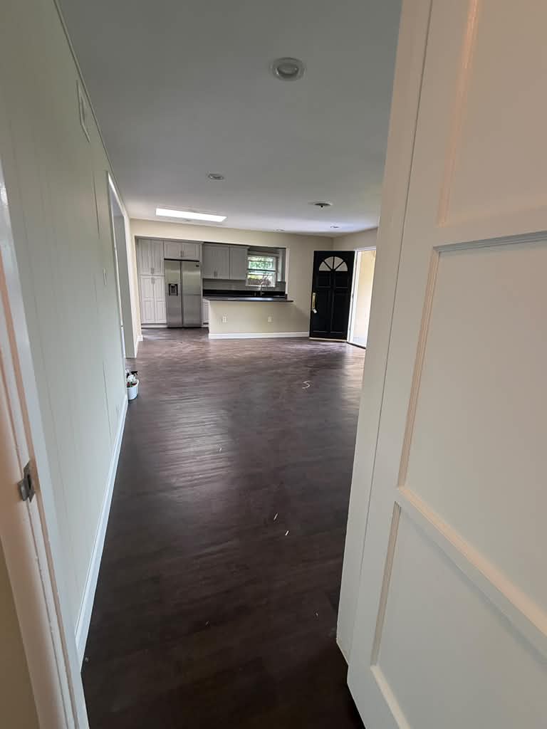 Open-plan entry and kitchen cleaned after remodeling