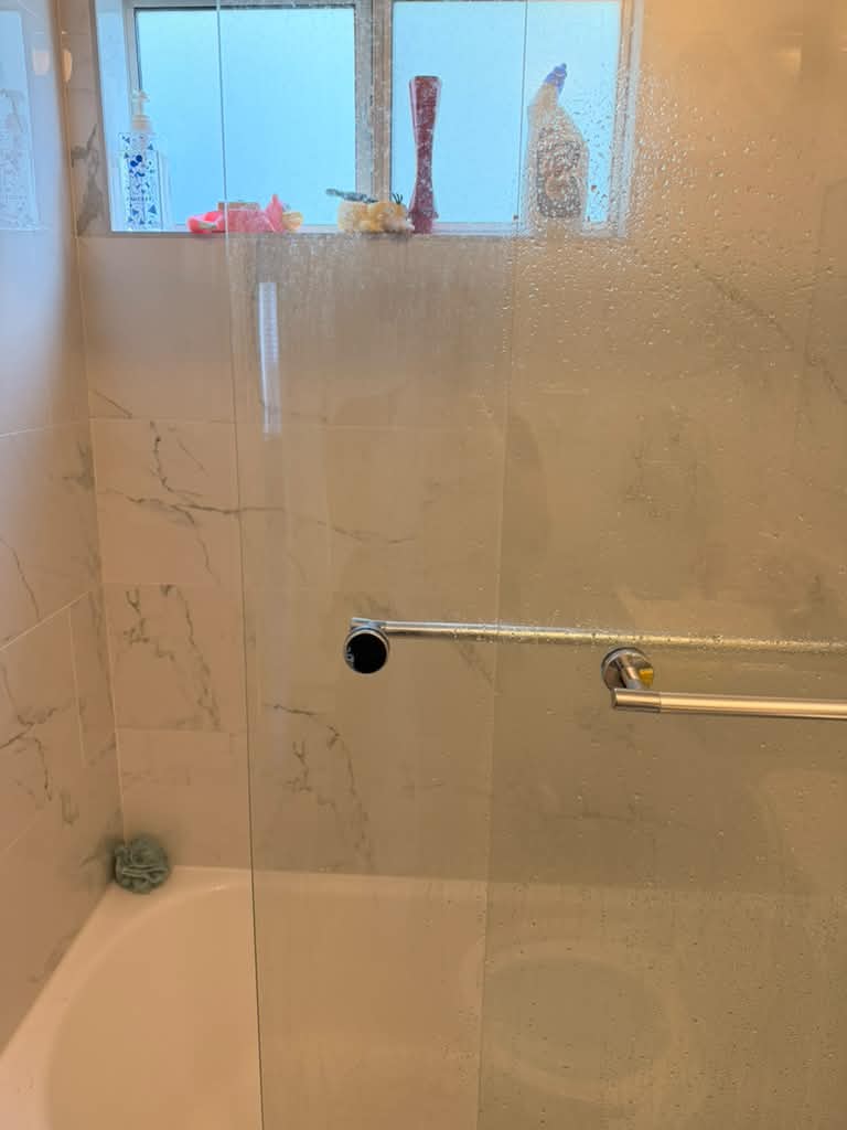 Cloudy shower glass before cleaning