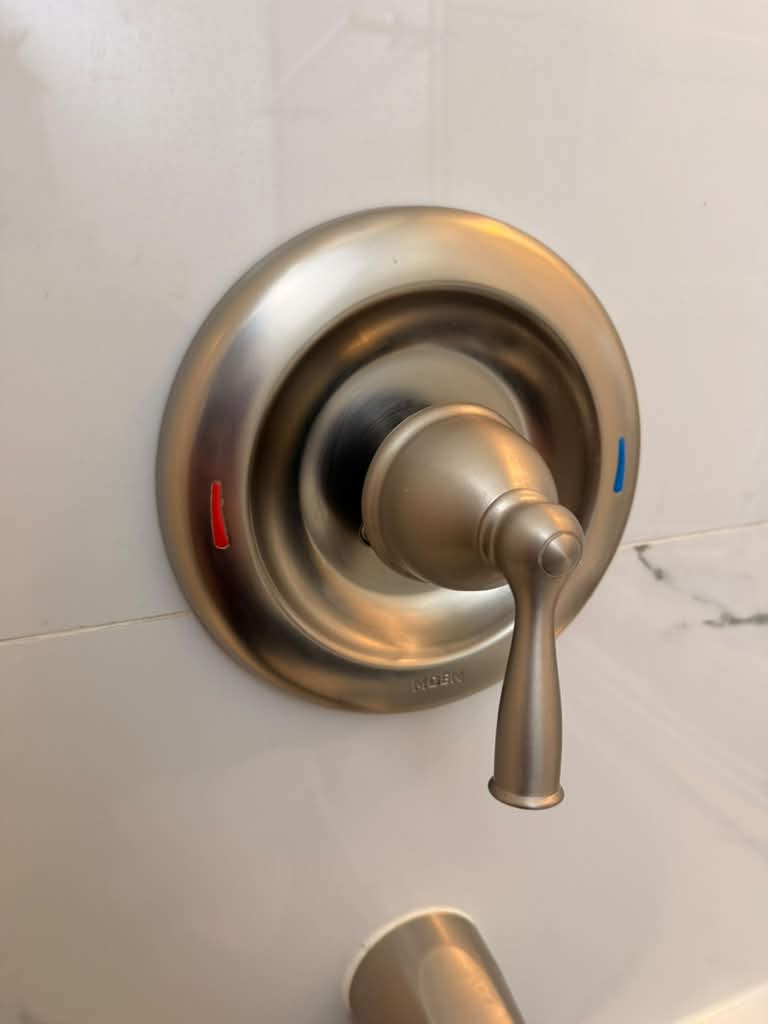 Polished shower handle after detailed cleaning